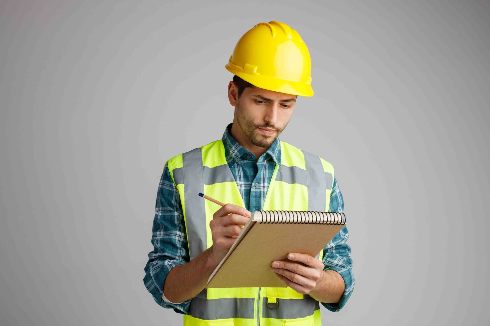 Contractor writing on form